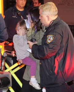 Marina and her daughter Nessie being Helped by EMS Workers.